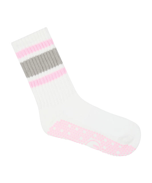 Bunte Grip Socken mit 80s-Streifen in Blau, Pink, Rot und Gelb – seitliche Ansicht auf weißem Hintergrund