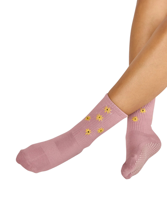 Mauve-farbene Socke mit gelben Gänseblümchen 