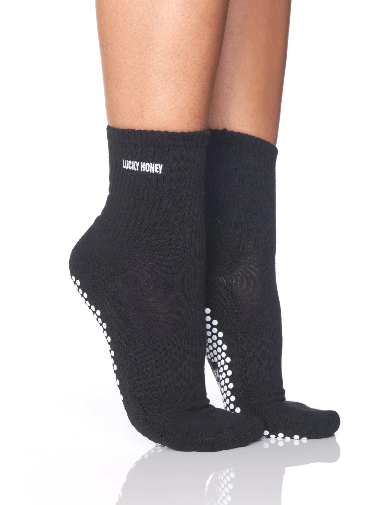 Minimalistische, hochwertige Grip Sock in Schwarz für maximale Performance.